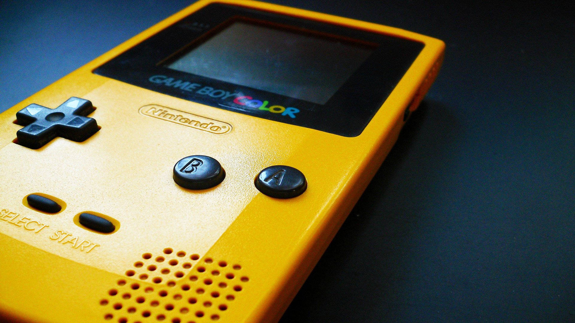 Closeup Da Game Boy Color Amarela. Papel de Parede
