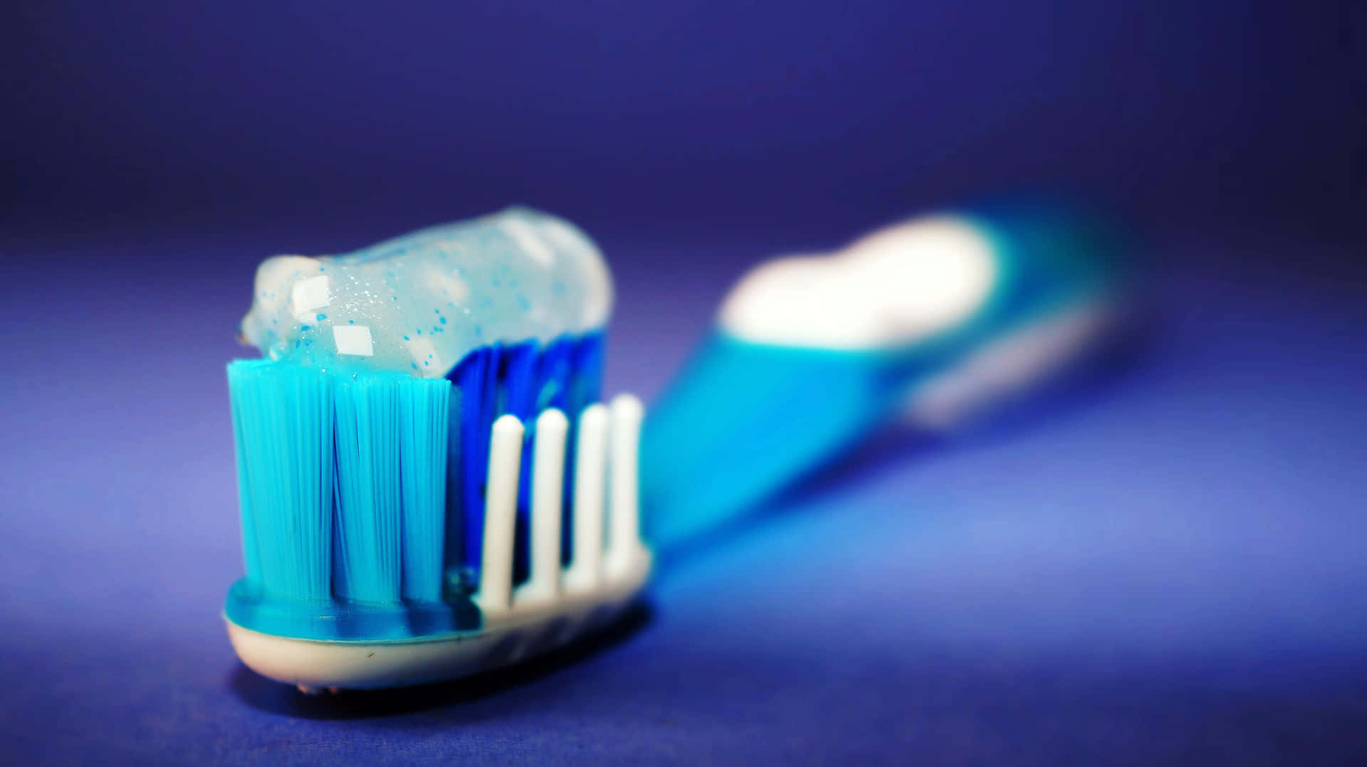 Close Up Toothbrush With Toothpaste Wallpaper