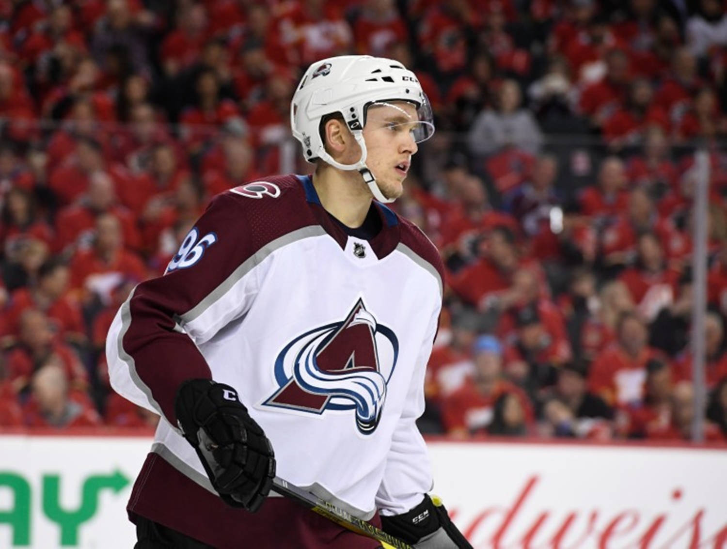 Close Up View Of Mikko Rantanen With Mouth Open Holding Hockey Stick Wallpaper