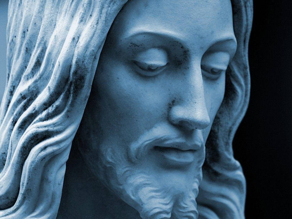 Closeup Of The Statue Of The Christian God Background