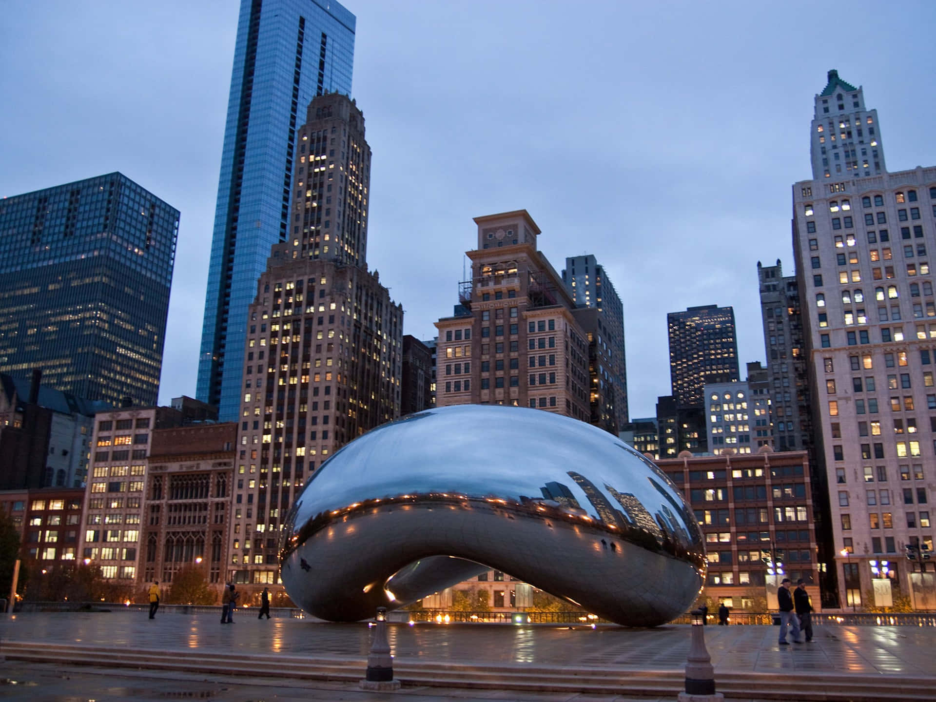 Cloud Gate And The City Lights Of Chicago Background