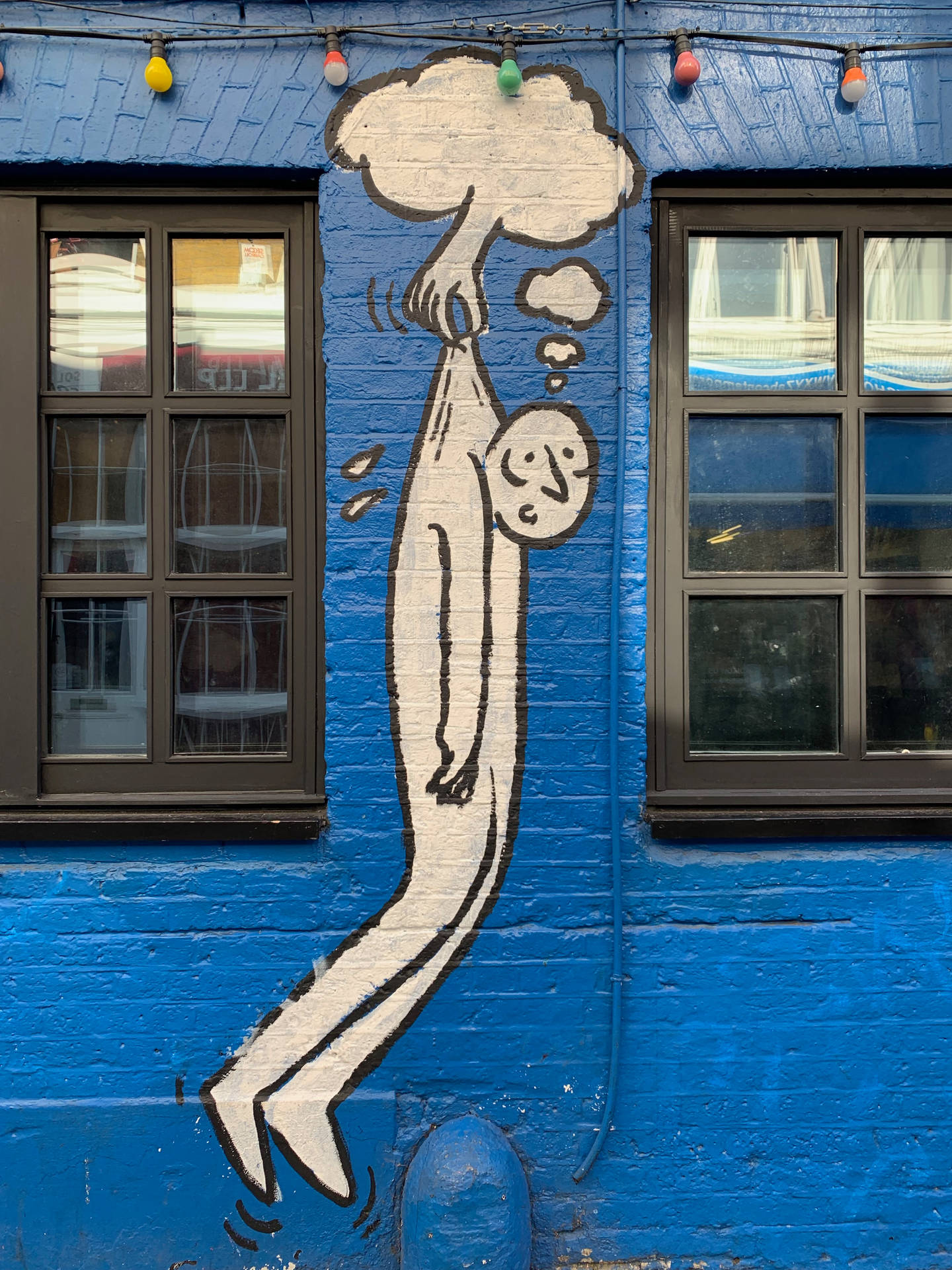 Cloud Grabs Man Street Art