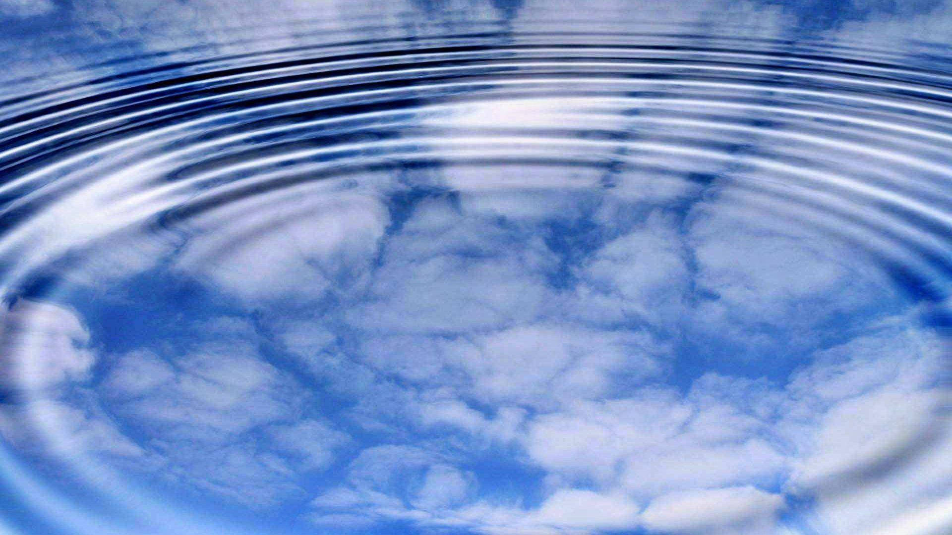 Cloud Reflection On Rippling Water Wallpaper