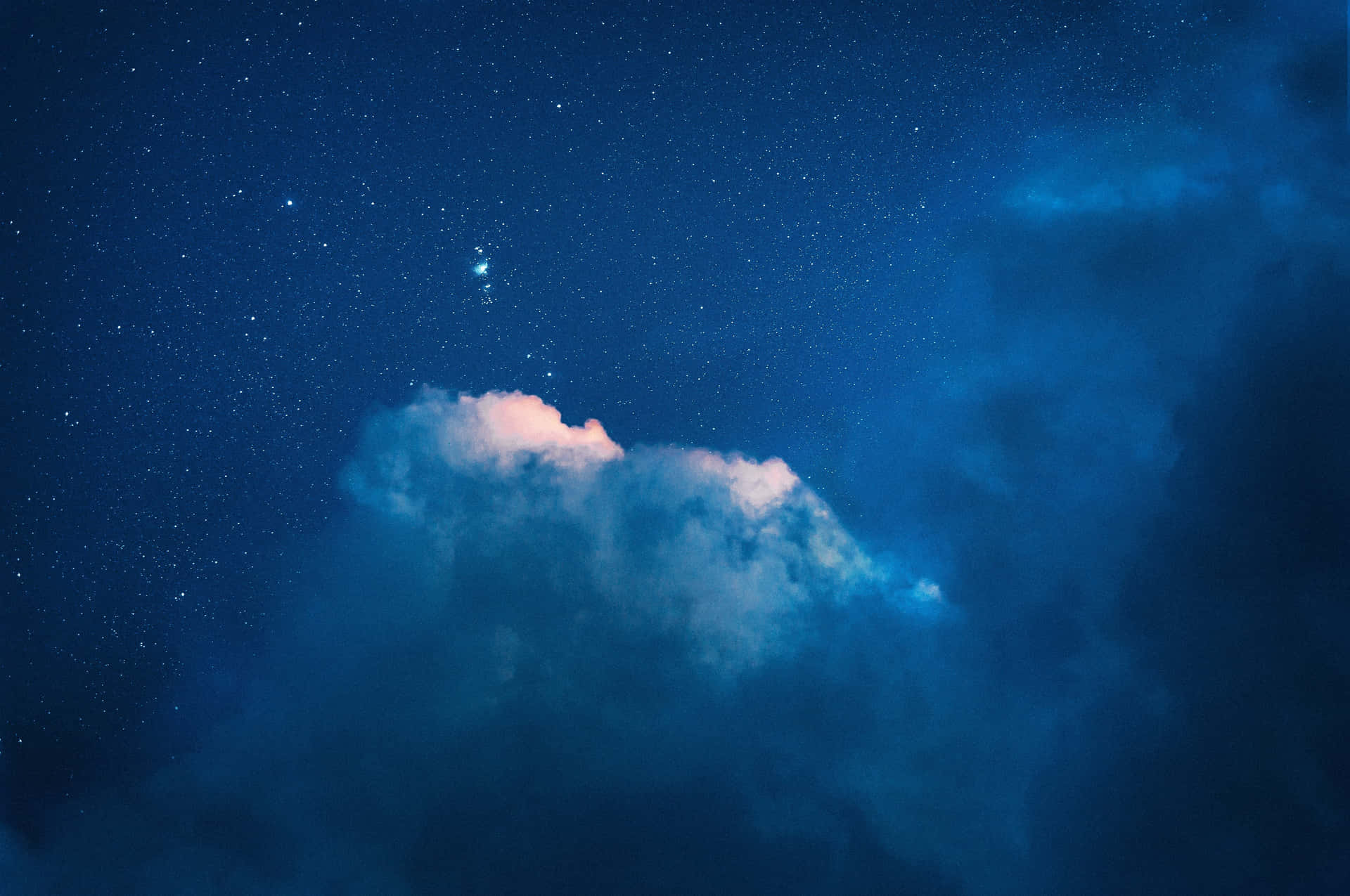 A picturesque view of clouds against a blue sky Wallpaper
