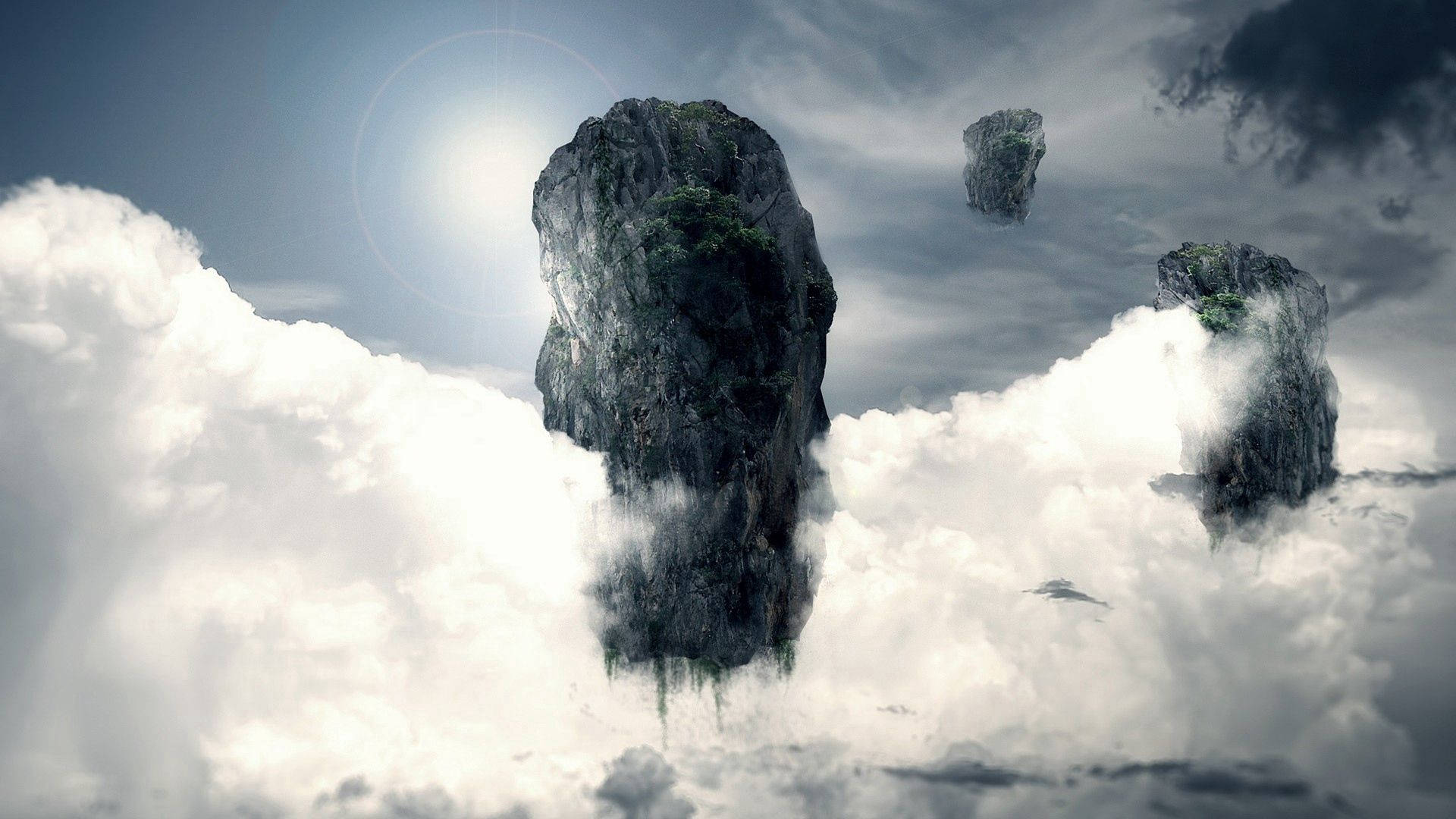 An aerial view of majestic rock islands surrounded by fluffy clouds Wallpaper
