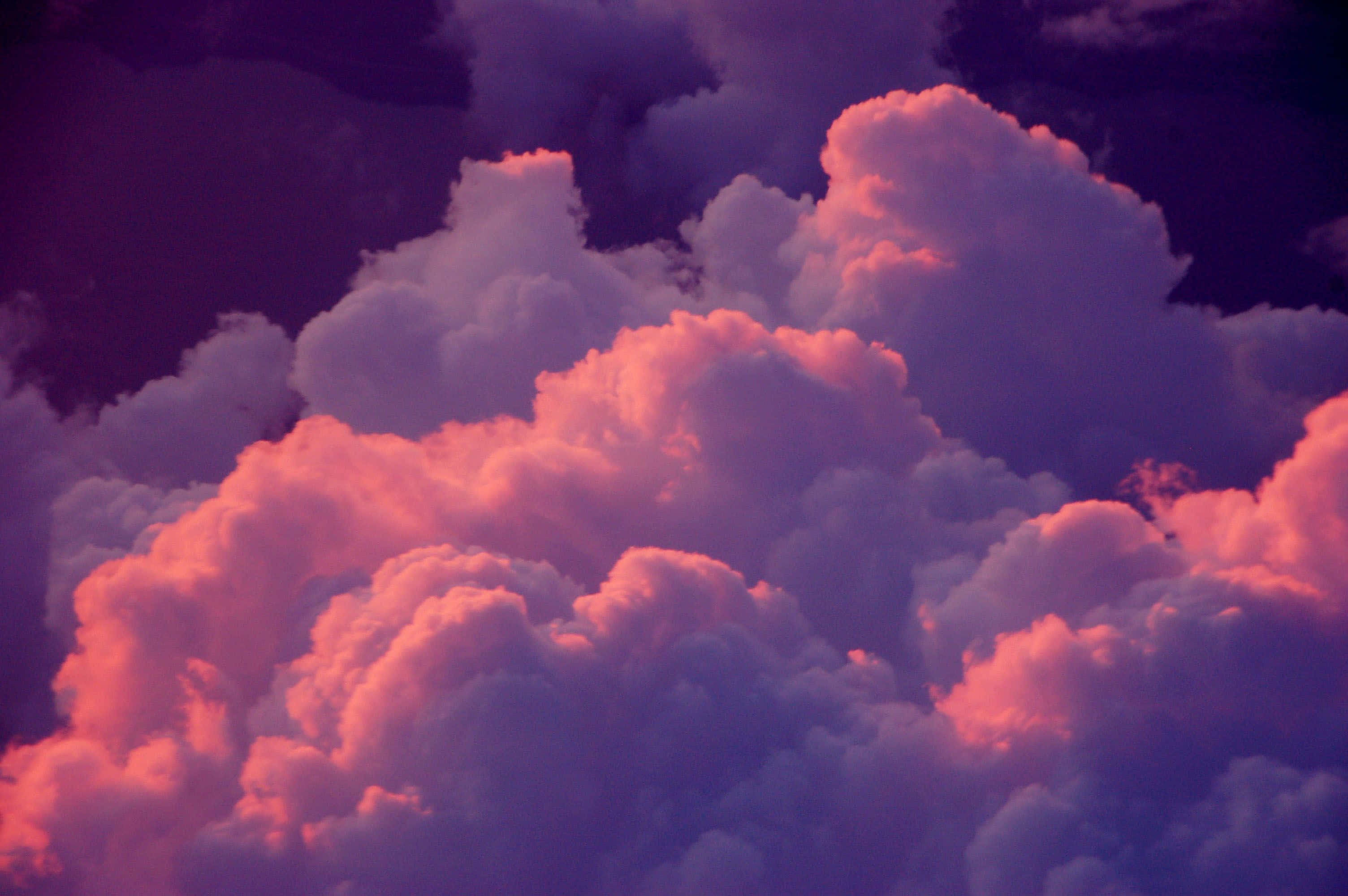 Pink Purple Fluffy Clouds Background