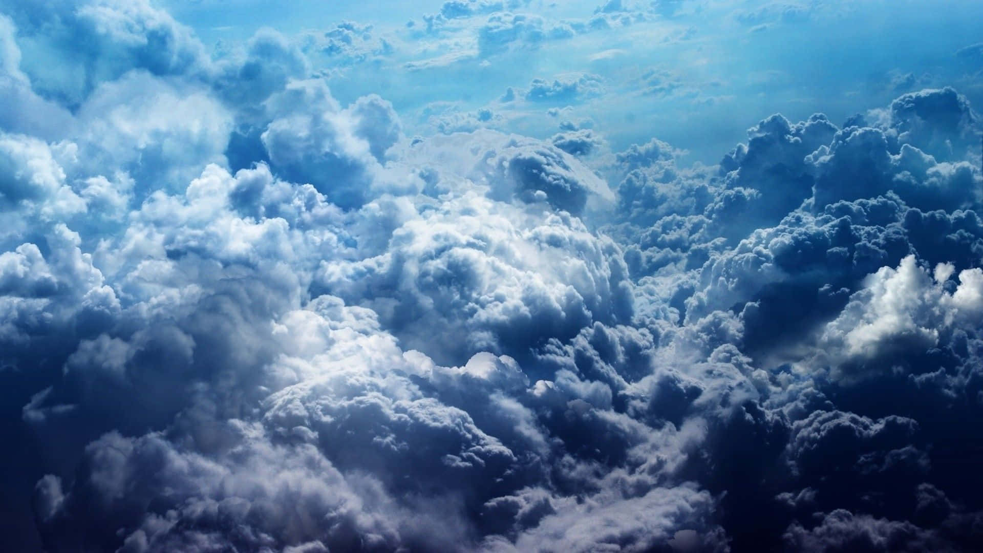Blue Sky And Dark Cumulonimbus Clouds Background