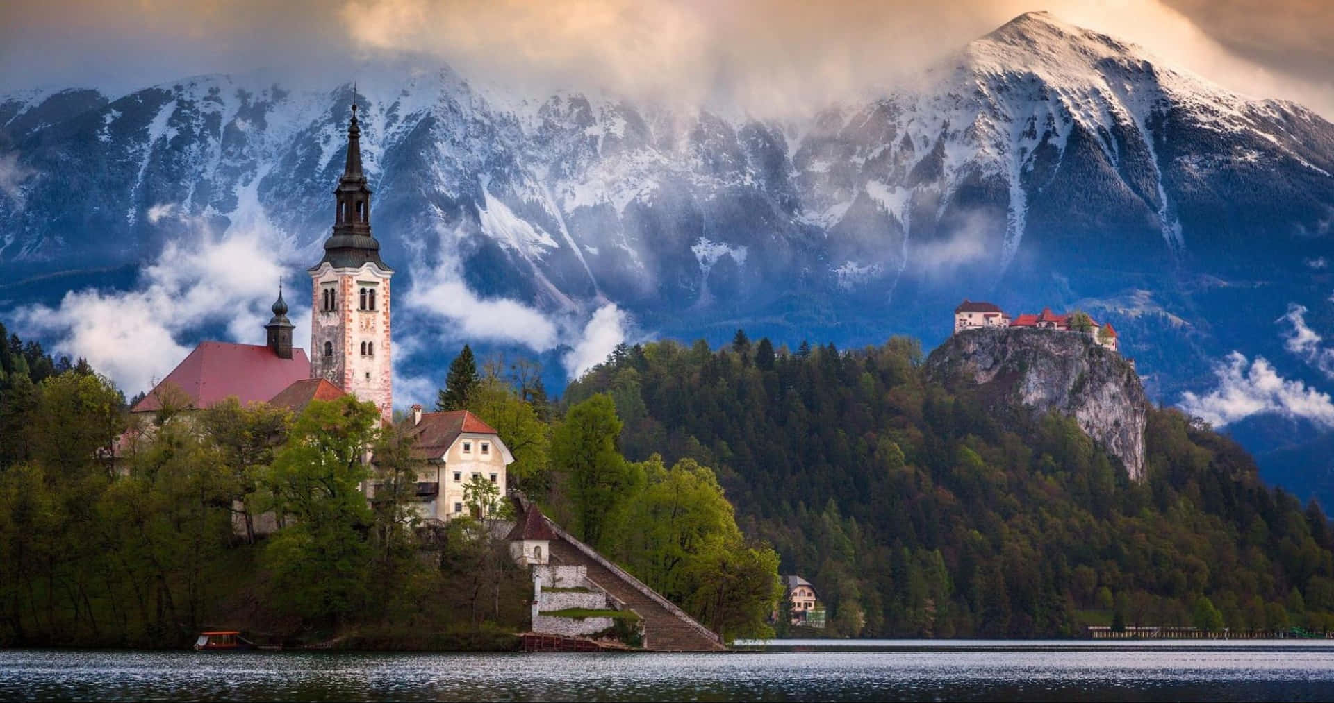 Clouds Reaching The Julian Alps Behind Lake Bled Wallpaper
