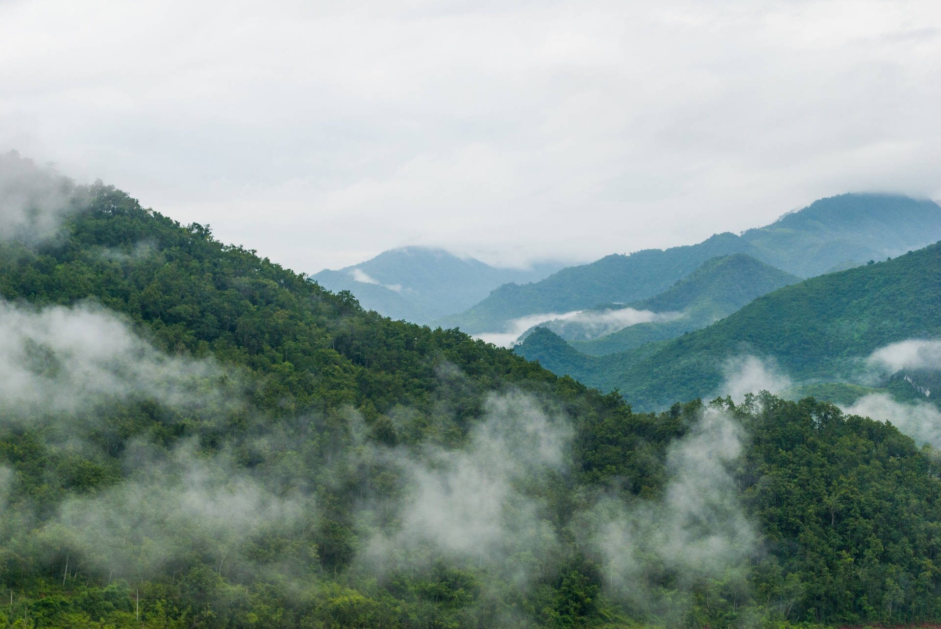 Enchanting Panorama of Cloudy Smoky Mountains Wallpaper