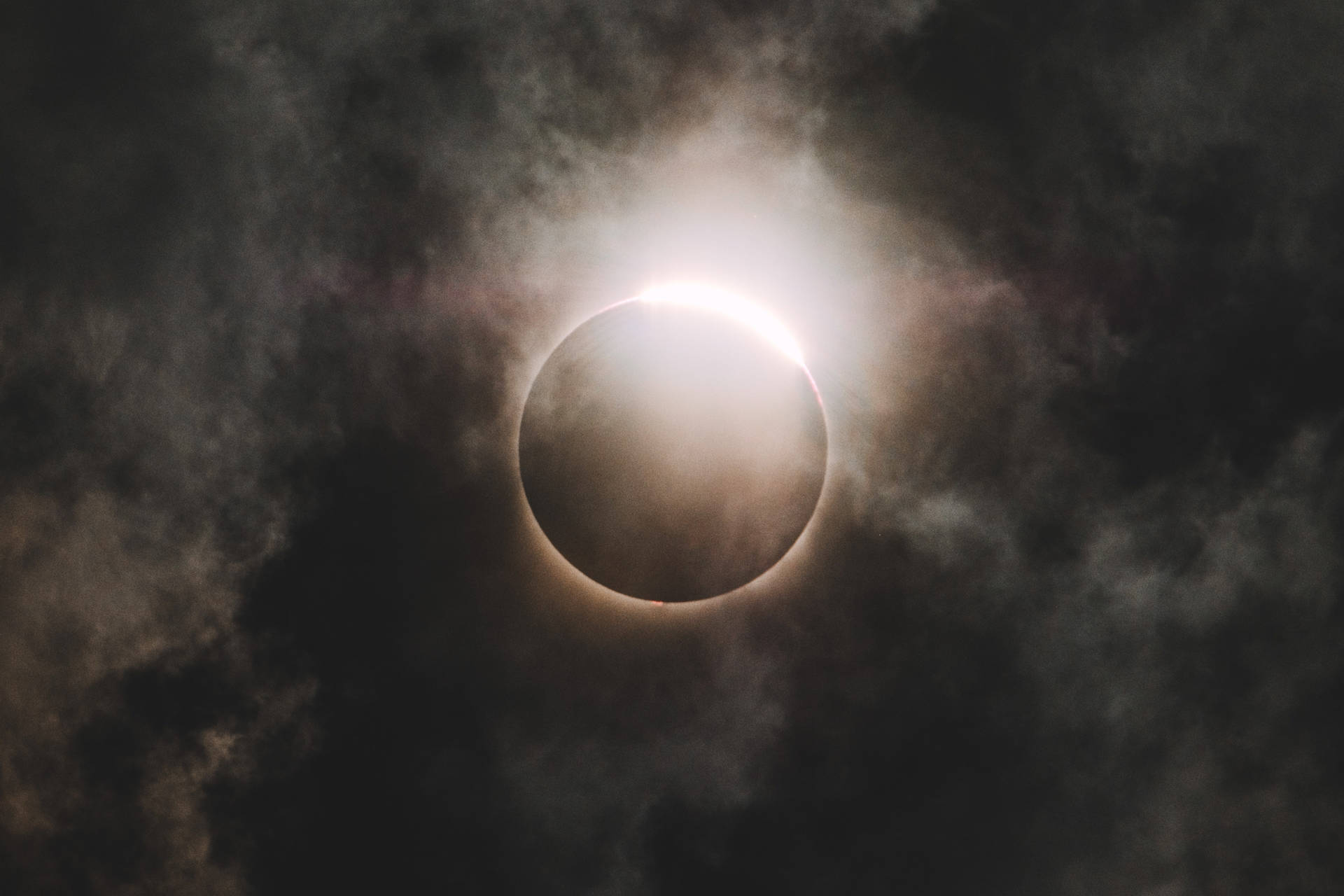 Cloudy Mid-Day Solar Eclipse Wallpaper