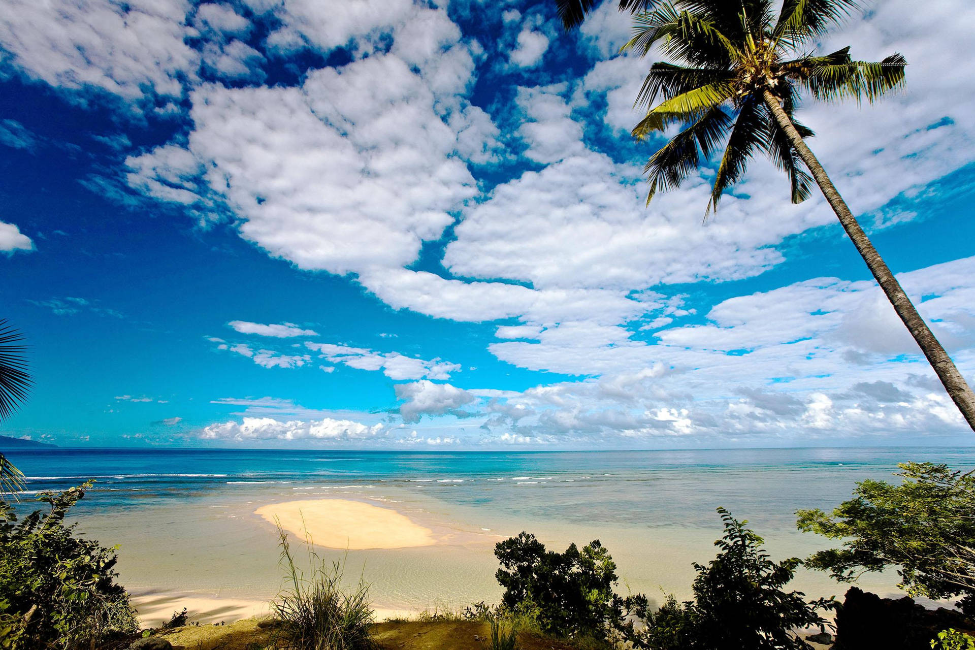 Cloudy Skies Beach In Comoros Background