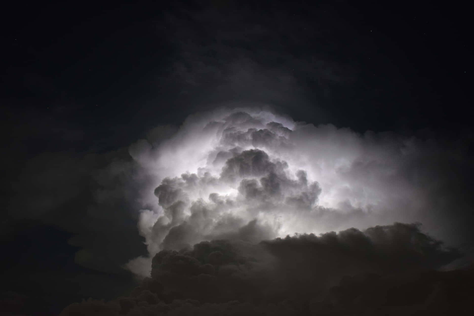 A Large Cloud Is Seen In The Sky At Night