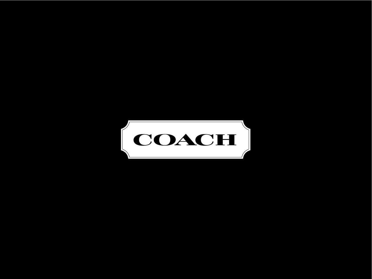 Ikonisk Coach logo bringer naturlig varme til en skrivebord. Wallpaper