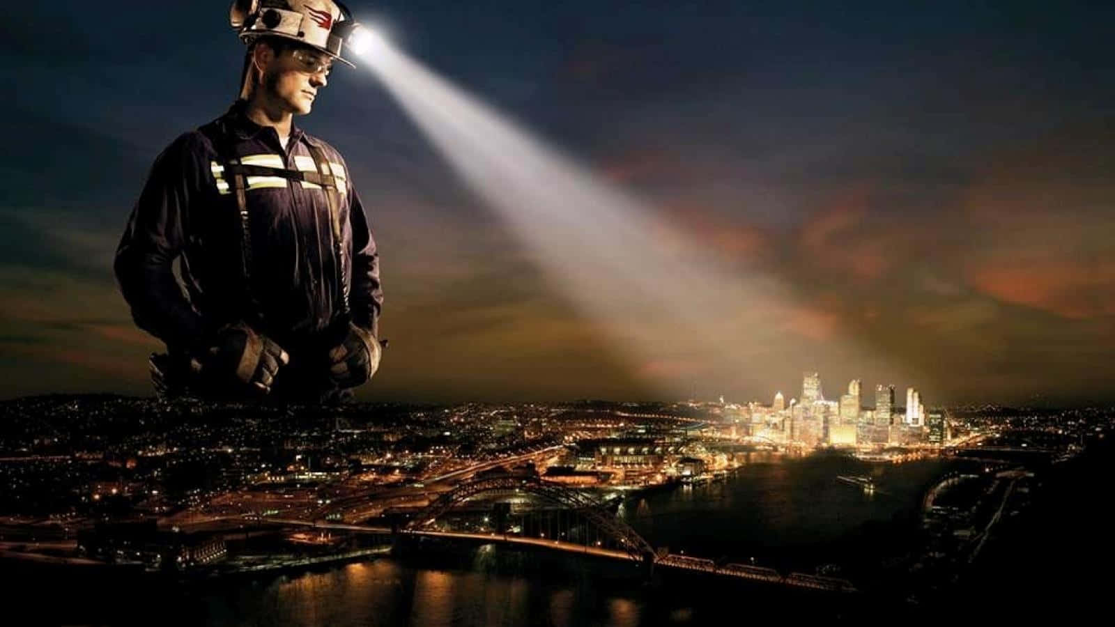 A Man In A Helmet Standing In Front Of A City