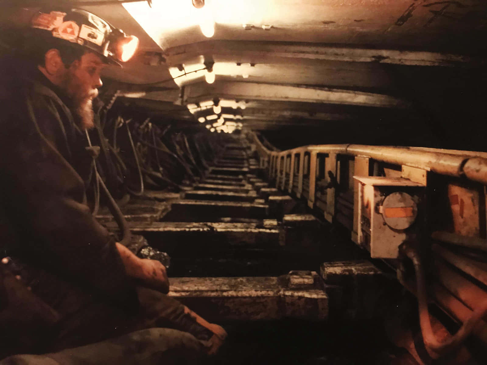 A Man Sitting In A Mine