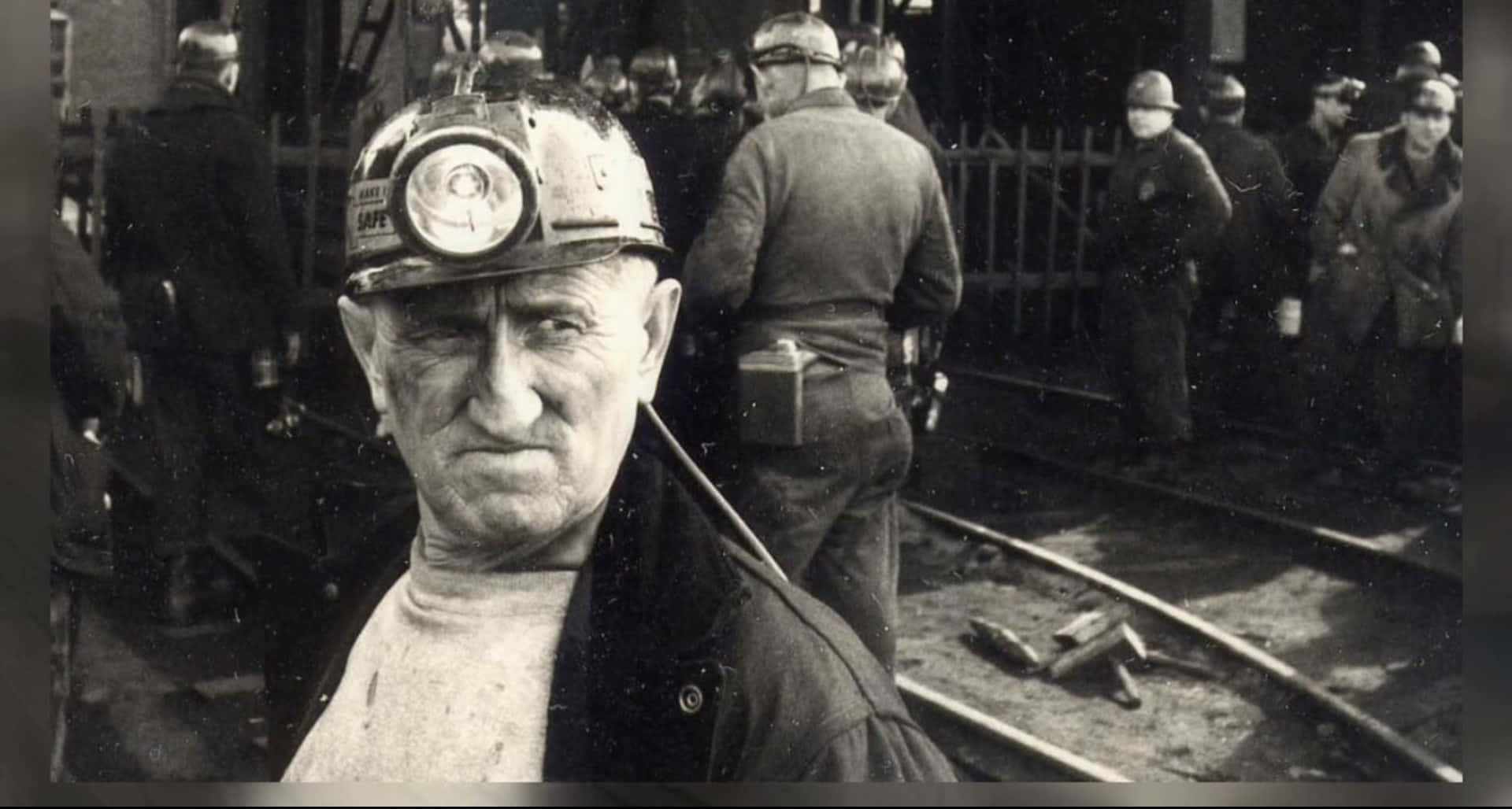 A Man In A Coal Mine With A Helmet