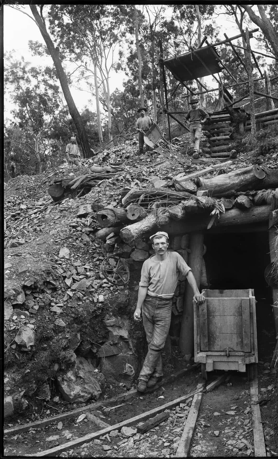 A Man Standing In Front Of A Mine