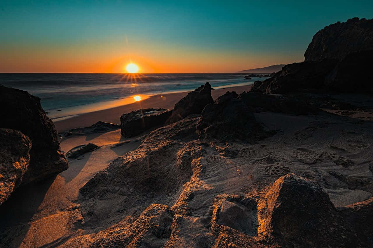 Caption: Coastal Sunset Enchantment Wallpaper