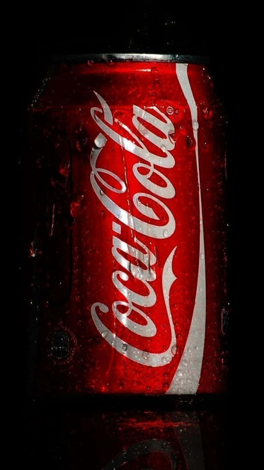 Chilled Coca-Cola bottle with a vibrant red logo on a classy black background