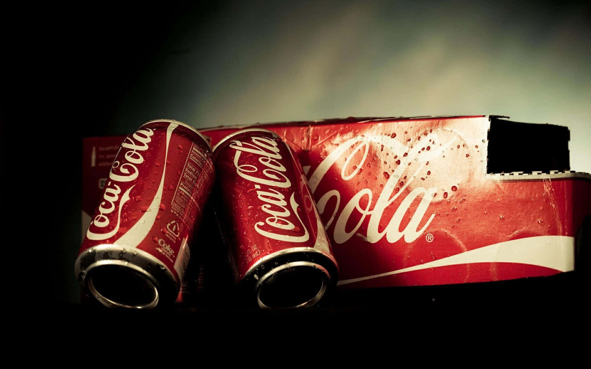 Coca Cola Cans On A Black Background