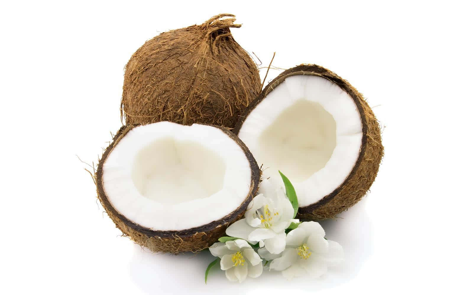 Coconut Oil And Flowers On A White Background