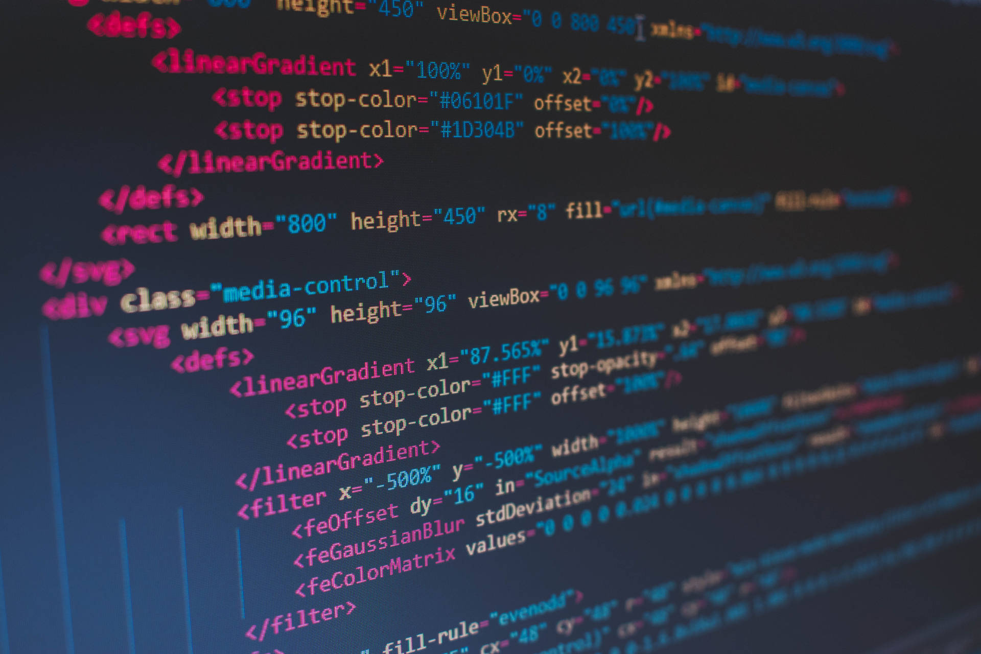 Coding on a Colorful Blur Wallpaper