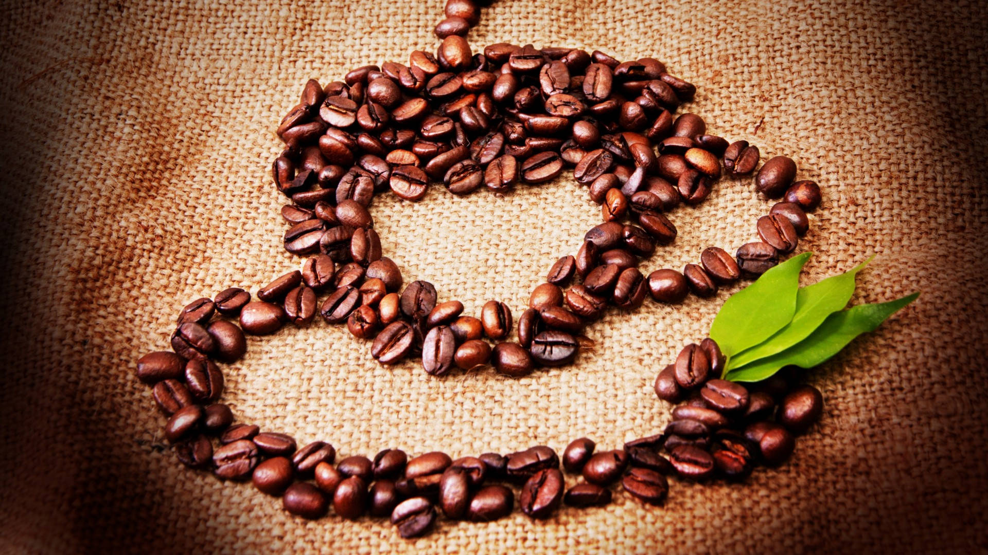 Coffee Beans Forming Coffee Cup Shape Background