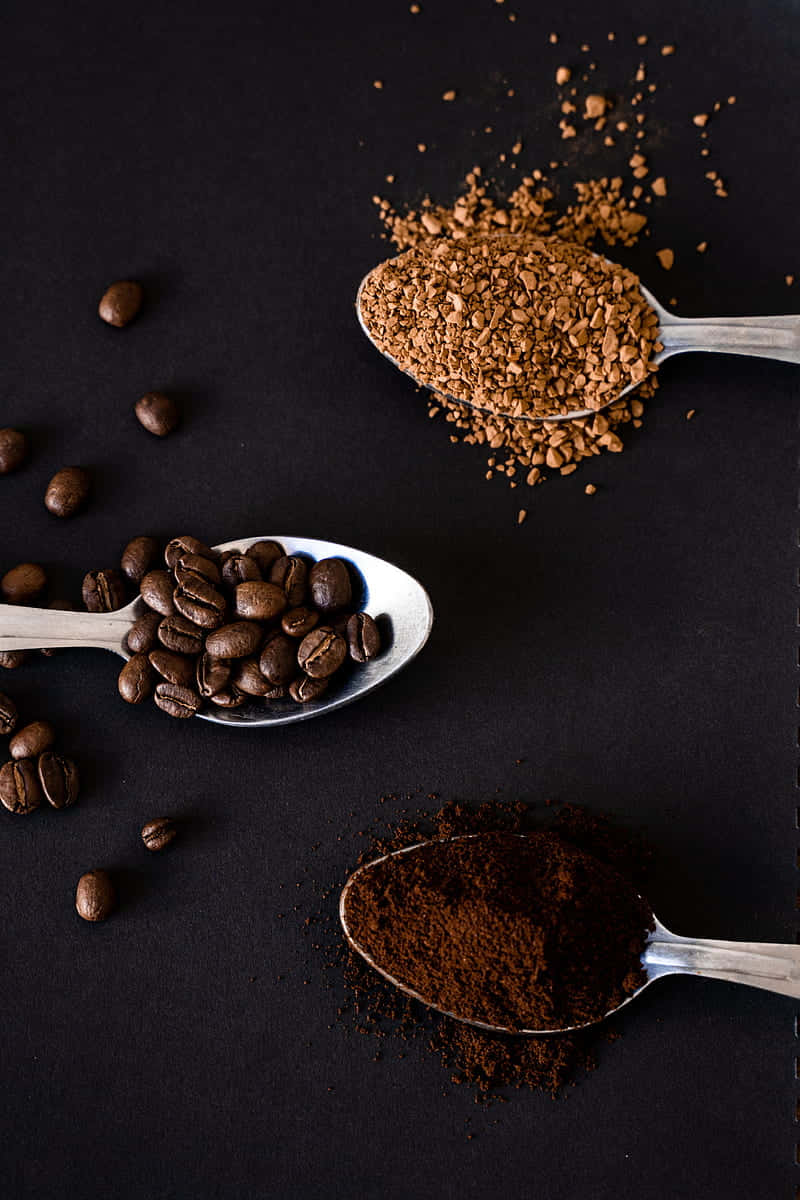 Coffee Beans Grounds Spoons Dark Background.jpg Wallpaper