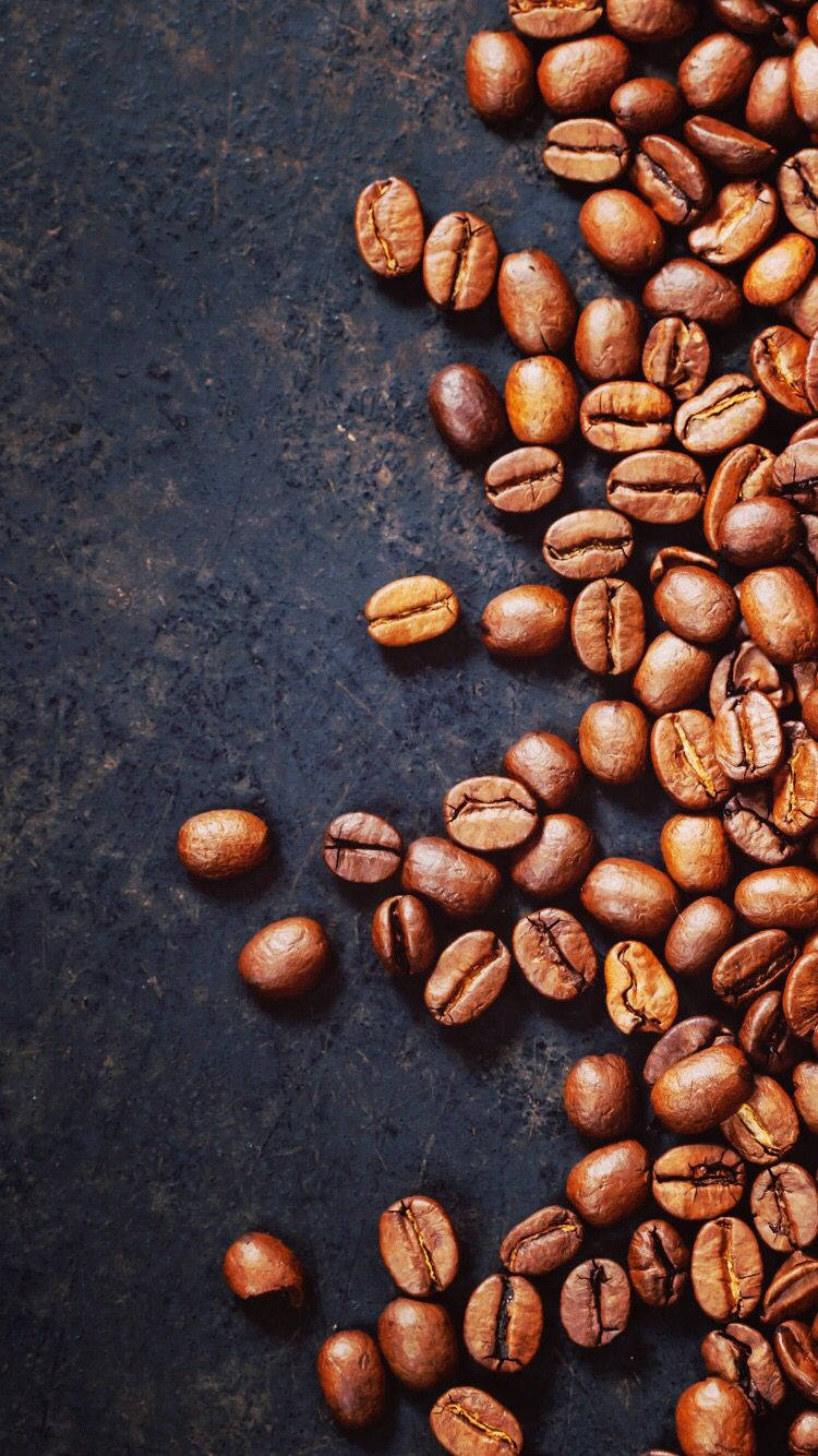 Gourmet coffee beans in a rustic setting Wallpaper