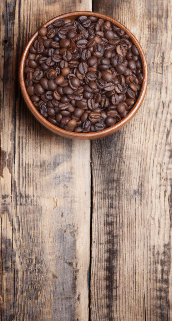 Coffee Beans In Earthenware Bowl Wallpaper