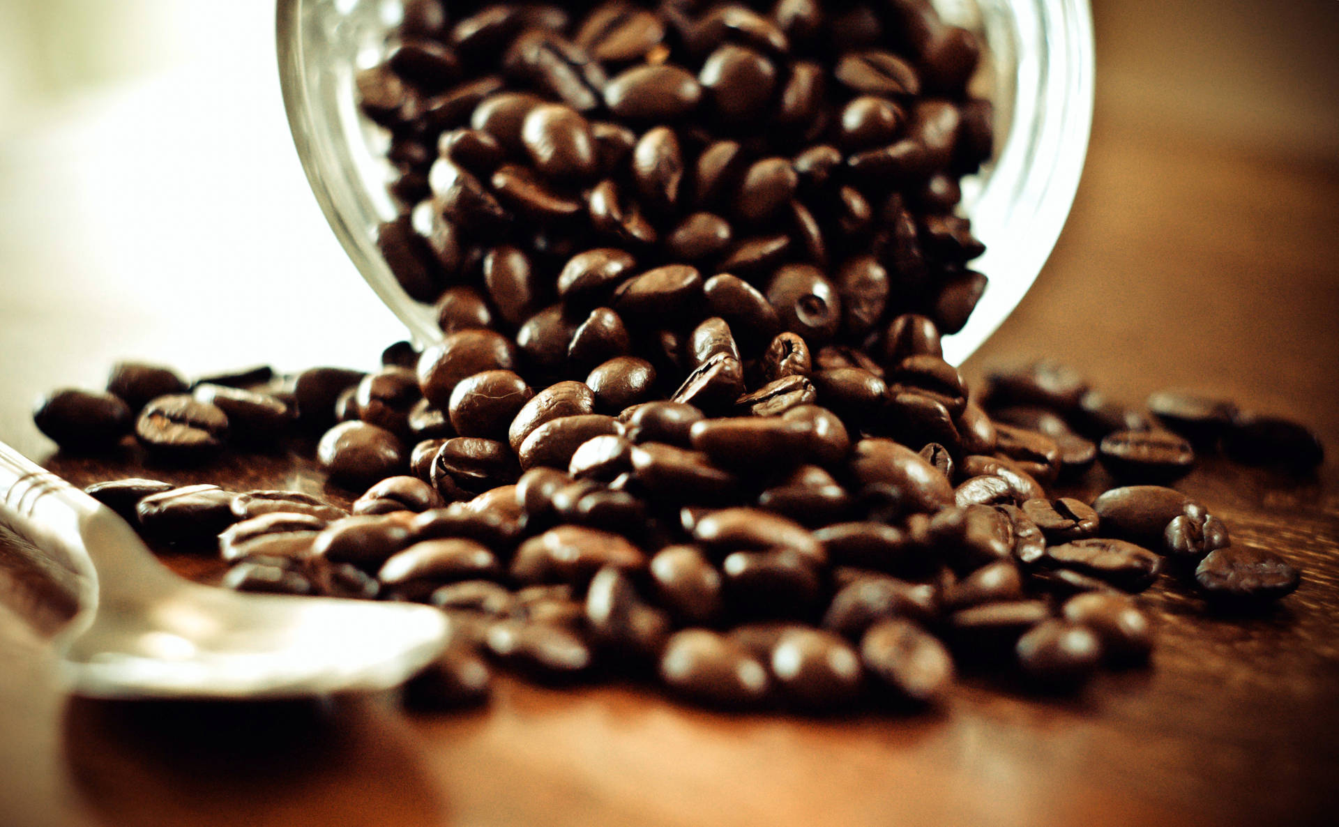 Coffee Beans Pouring Out Of Jar Wallpaper