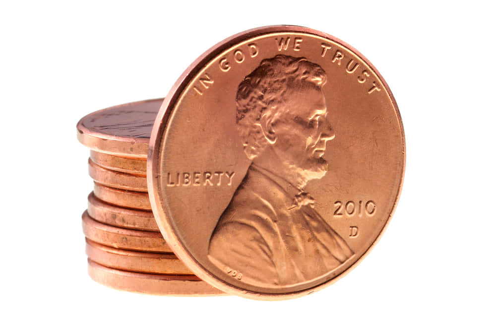 a stack of pennies on a white background