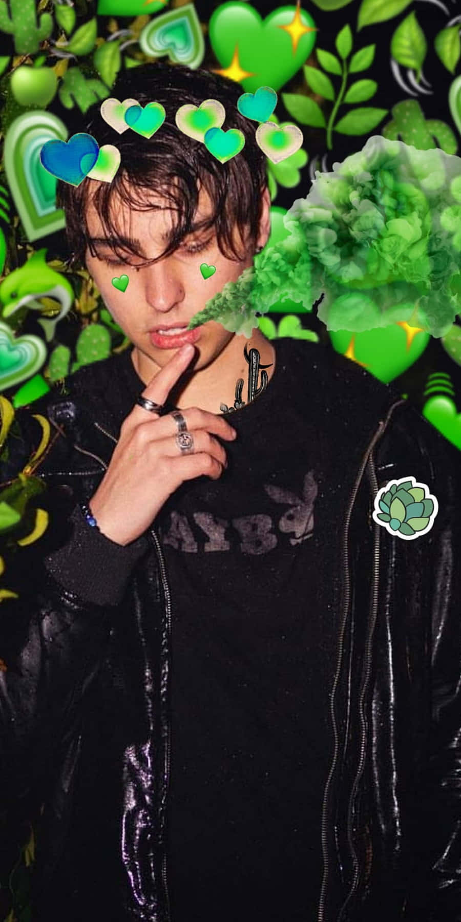 A Man Smoking A Cigarette In Front Of Green Hearts Wallpaper
