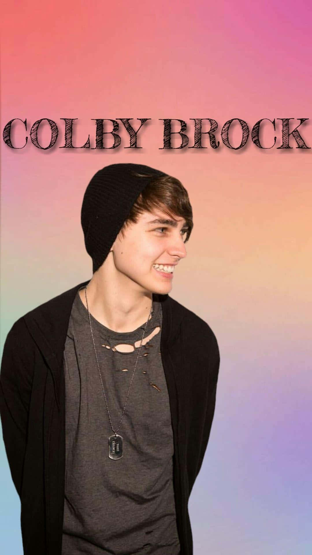 Colby Brock strikes a winning pose in a featured photo. Wallpaper