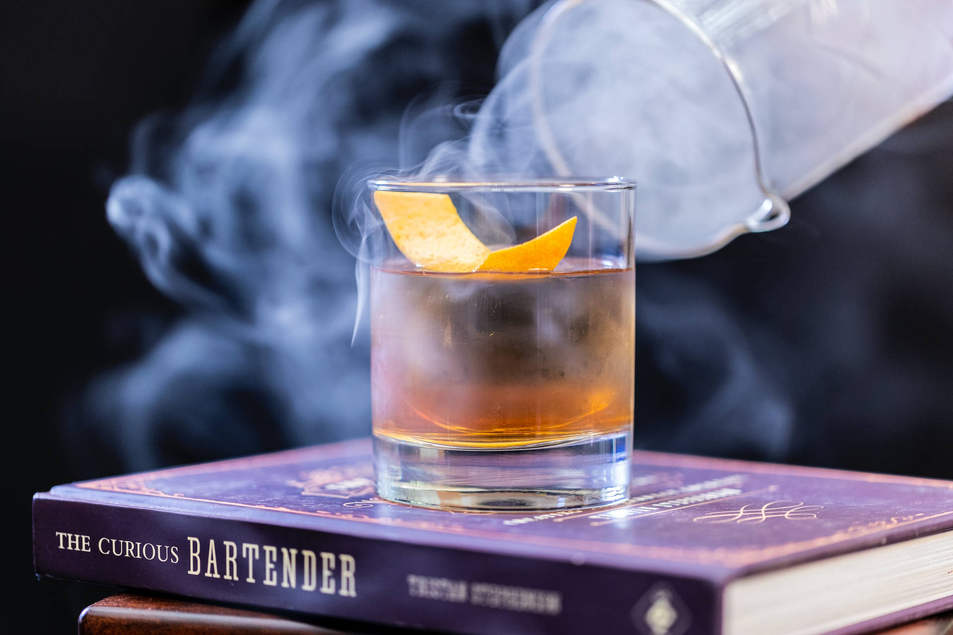 Cold Smokey Whiskey On Book Pile Wallpaper