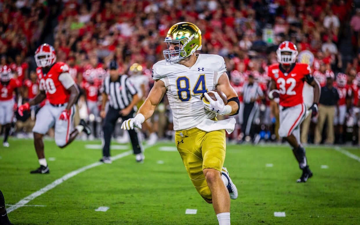 Cole Kmet Notre Dame Football Action Wallpaper