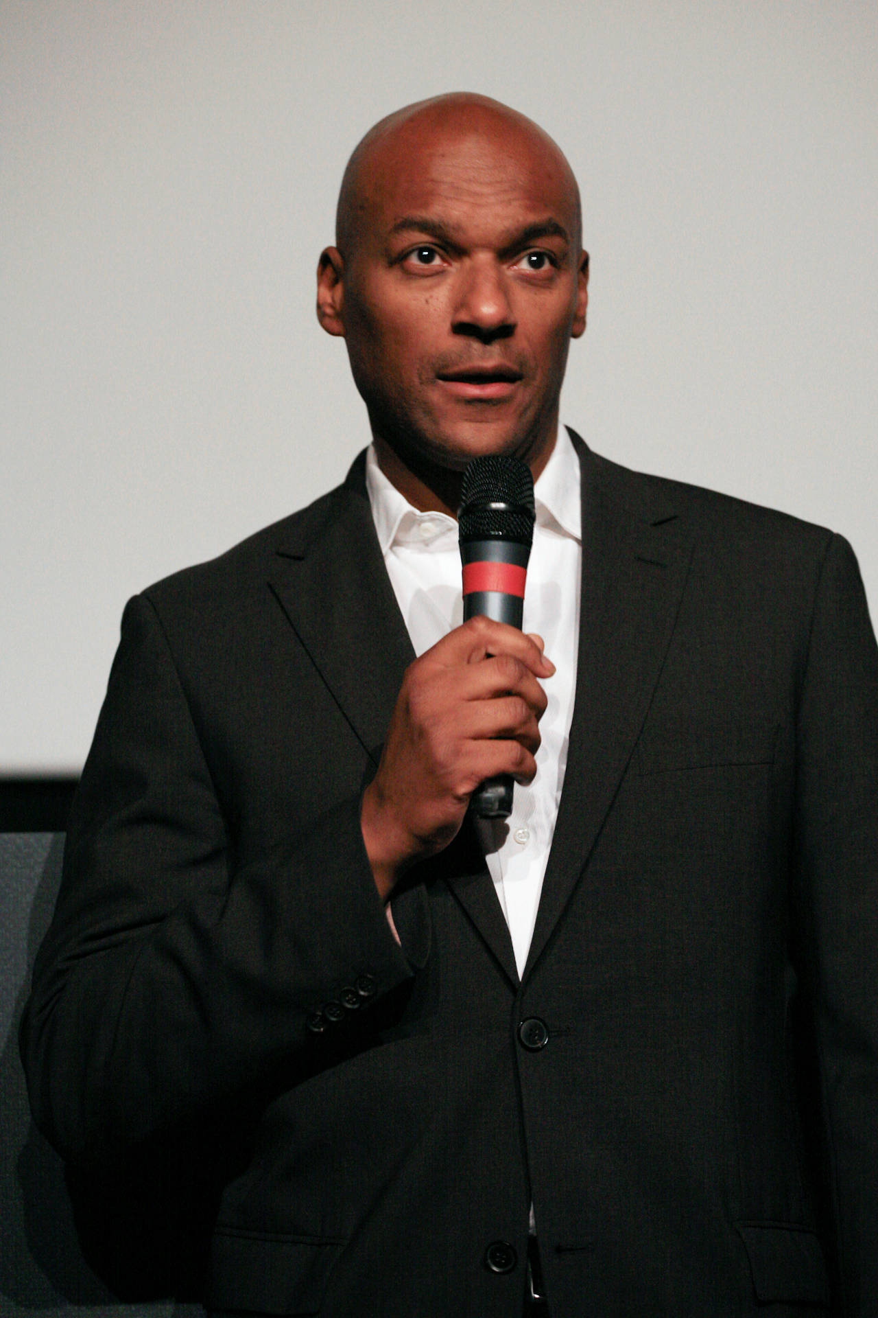 Colin Salmon Holding Microphone Wallpaper