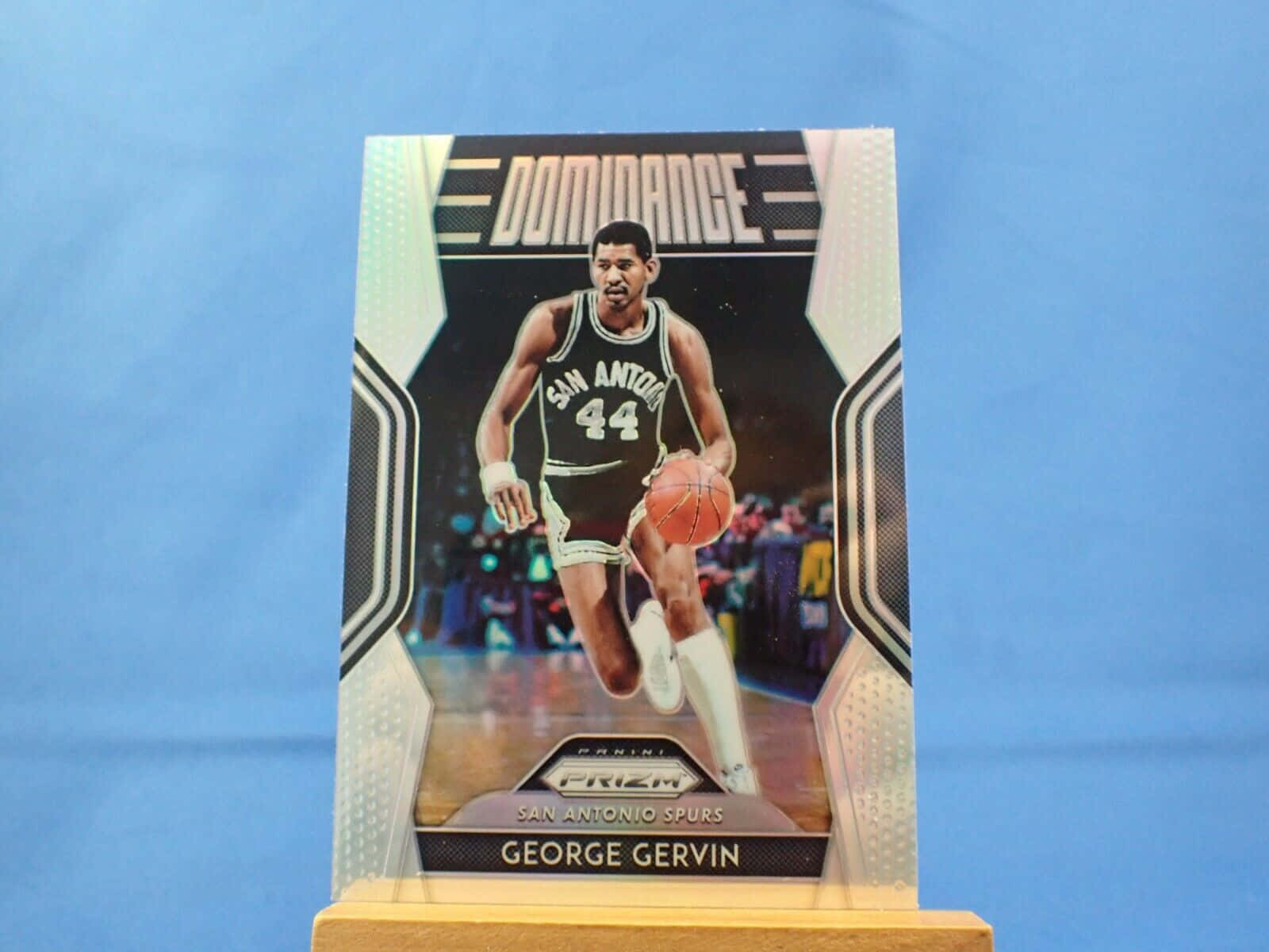 Iconic Collectible Card of Basketball Legend George Gervin Wallpaper