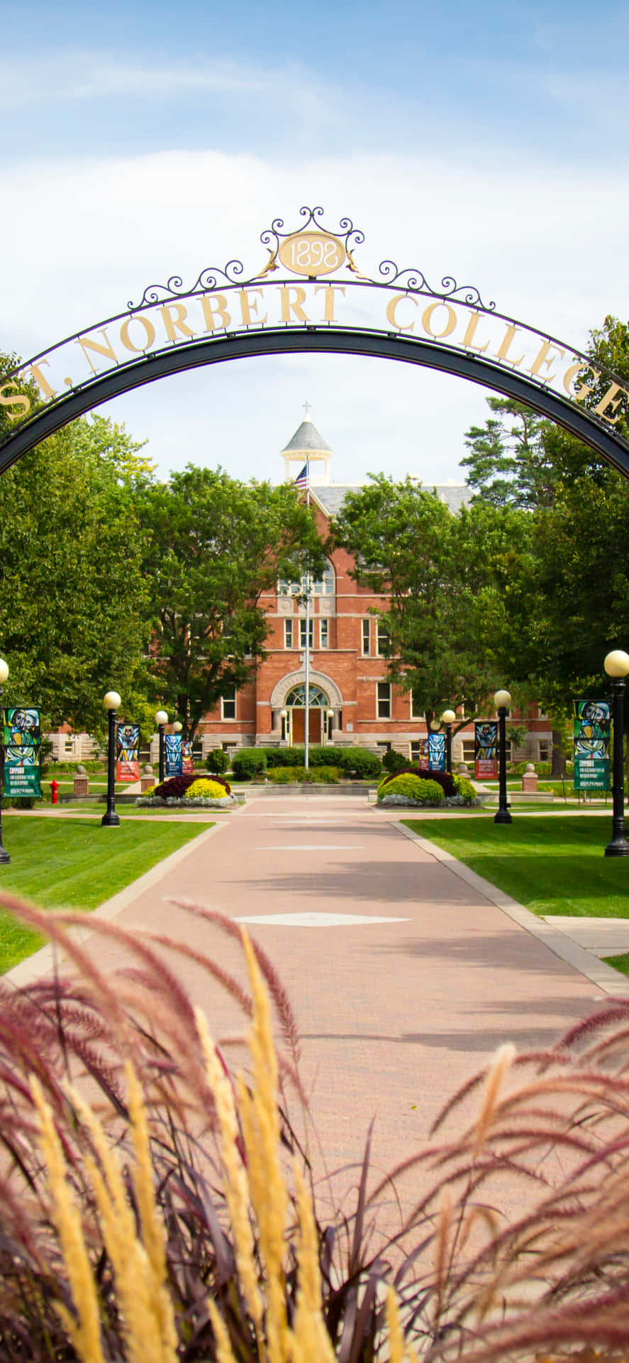 A Large Archway With A Sign That Says University Of Michigan