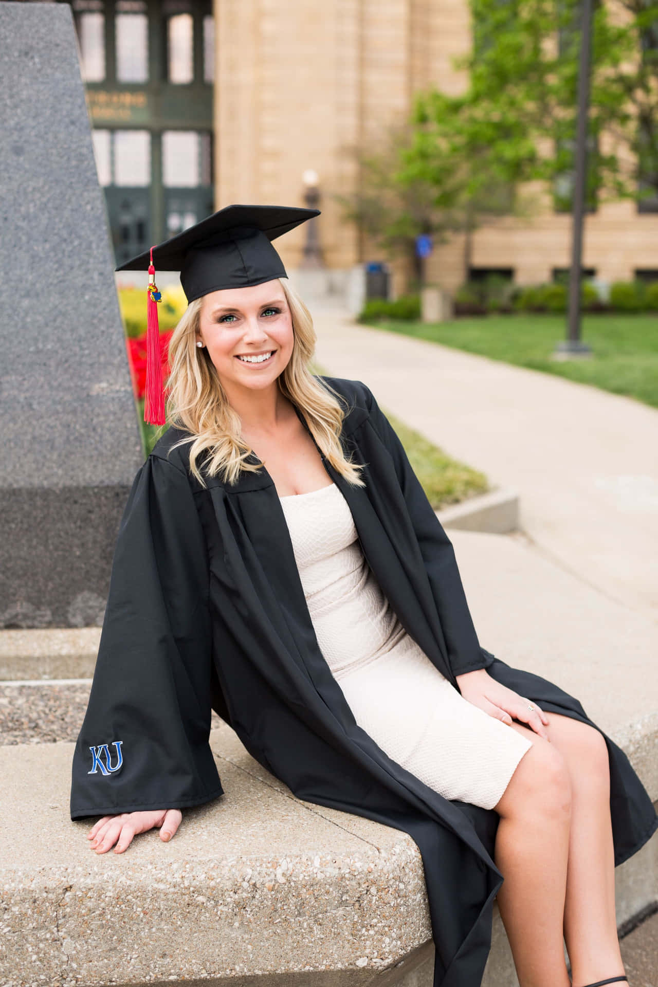 Woman Sitting College Graduation Picture