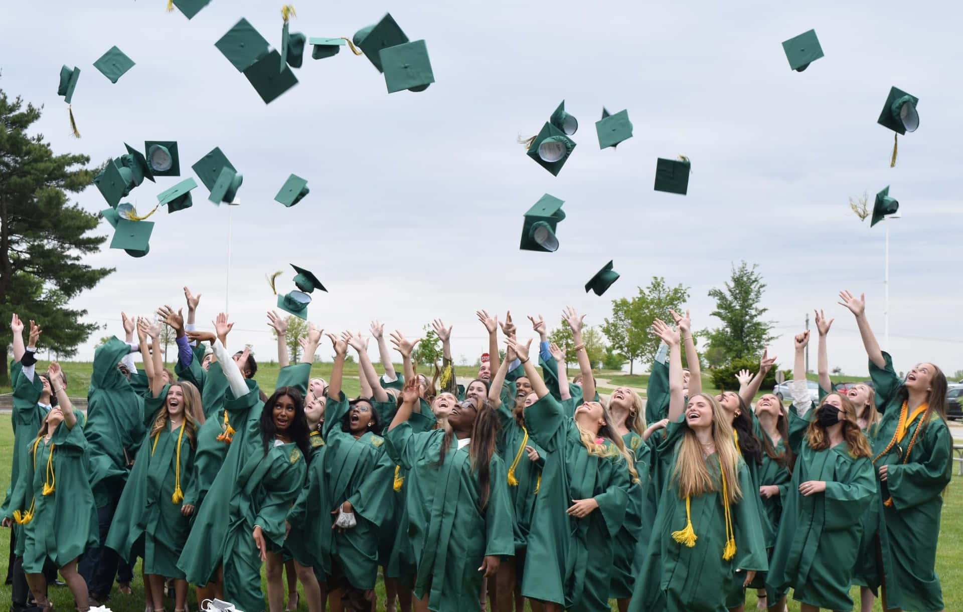 Graduates Throwing Their Caps In The Air