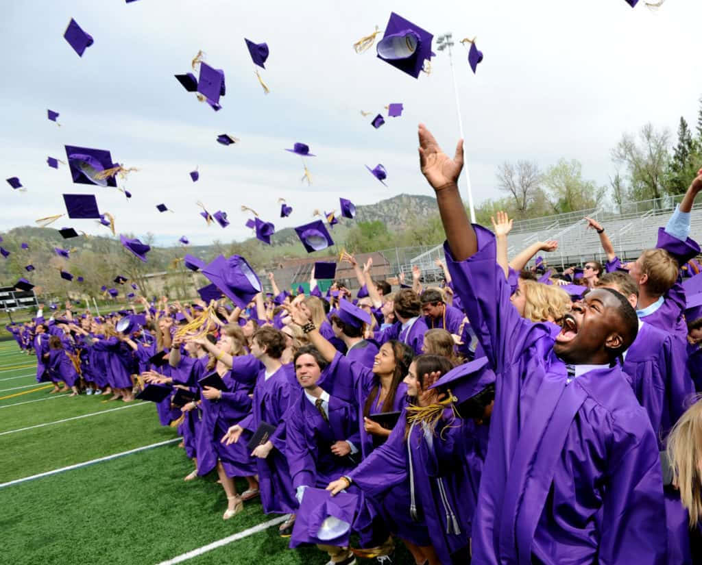 Throwing Violet Caps College Graduation Picture