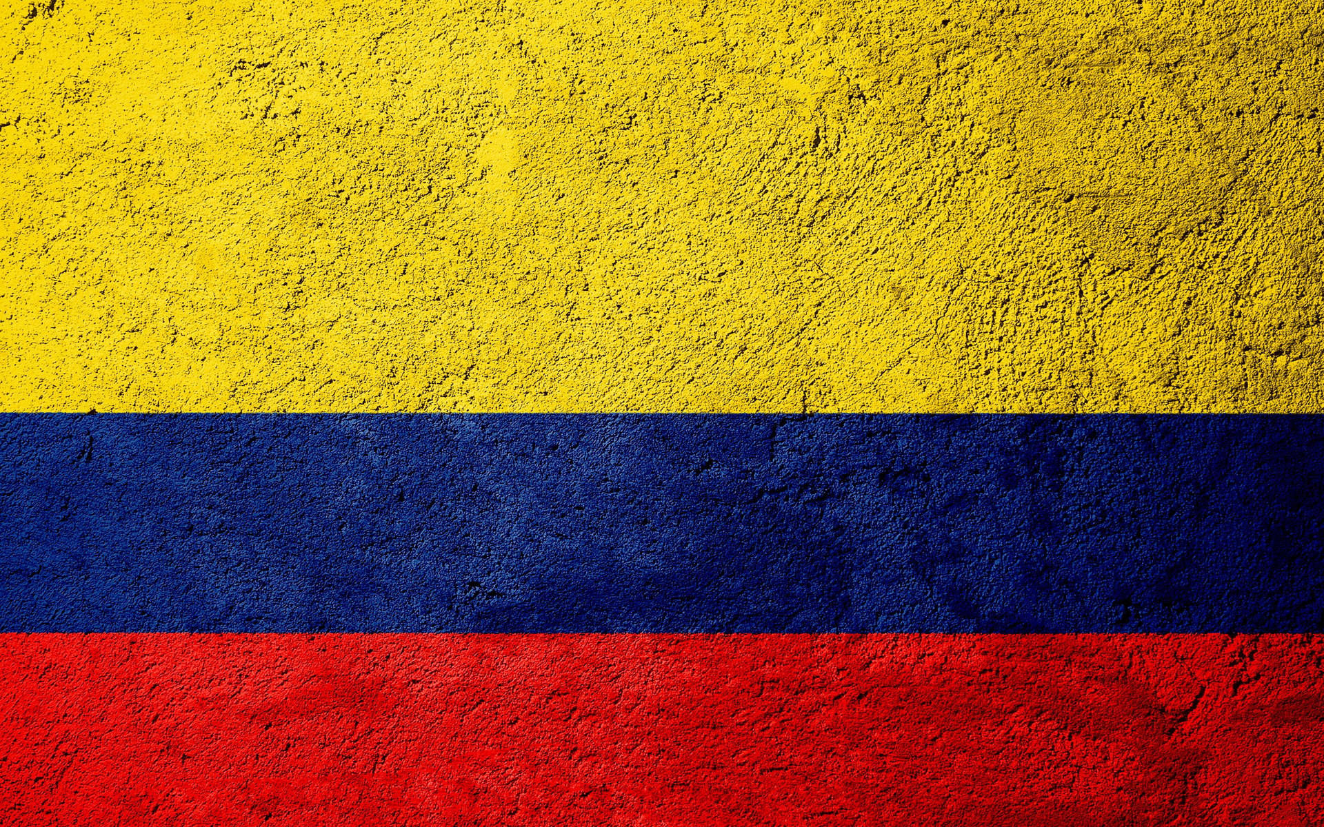 Kolumbianischeflagge Auf Beton Wallpaper