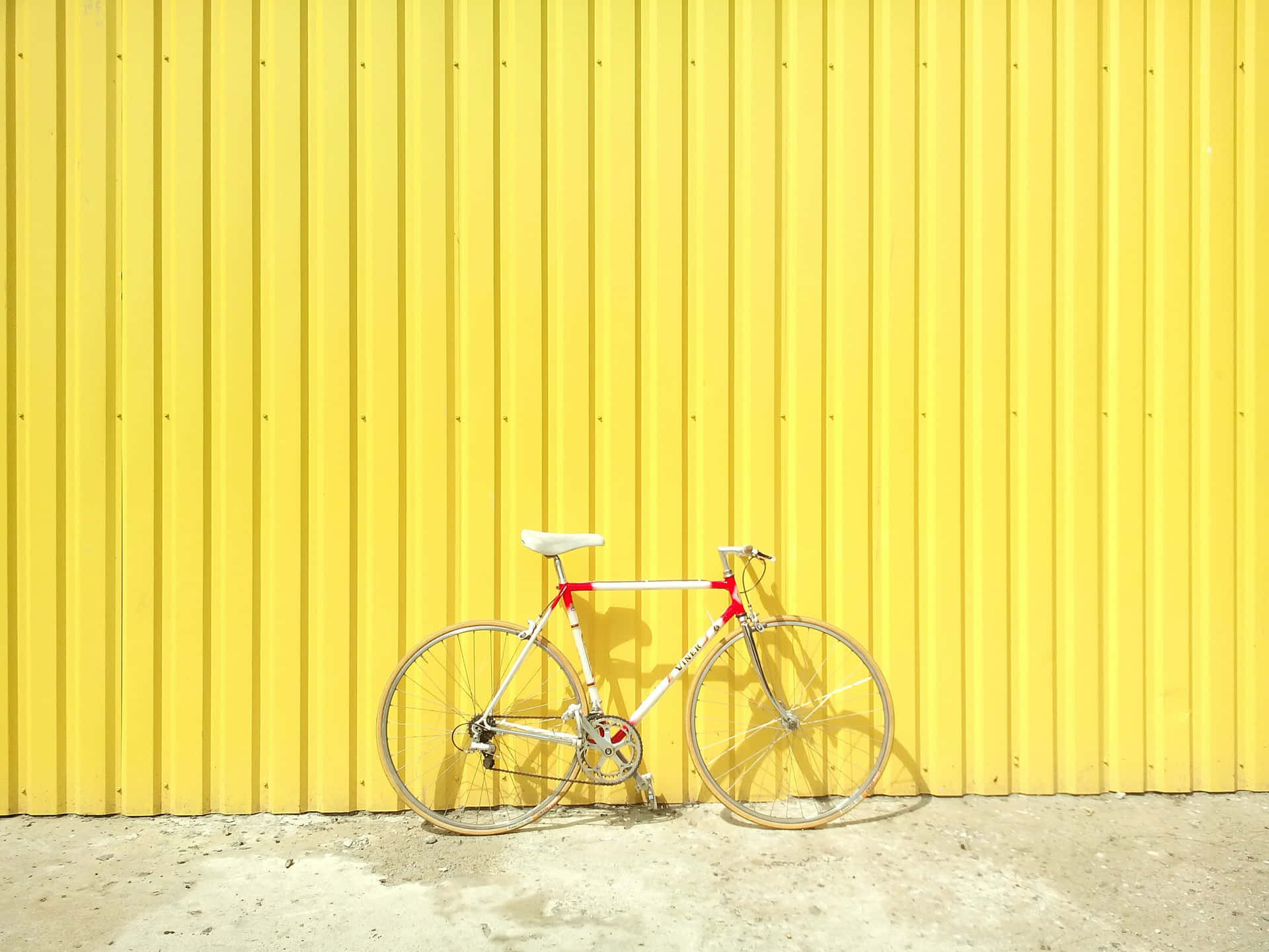 Bicycle On Yellow Metal Color Background