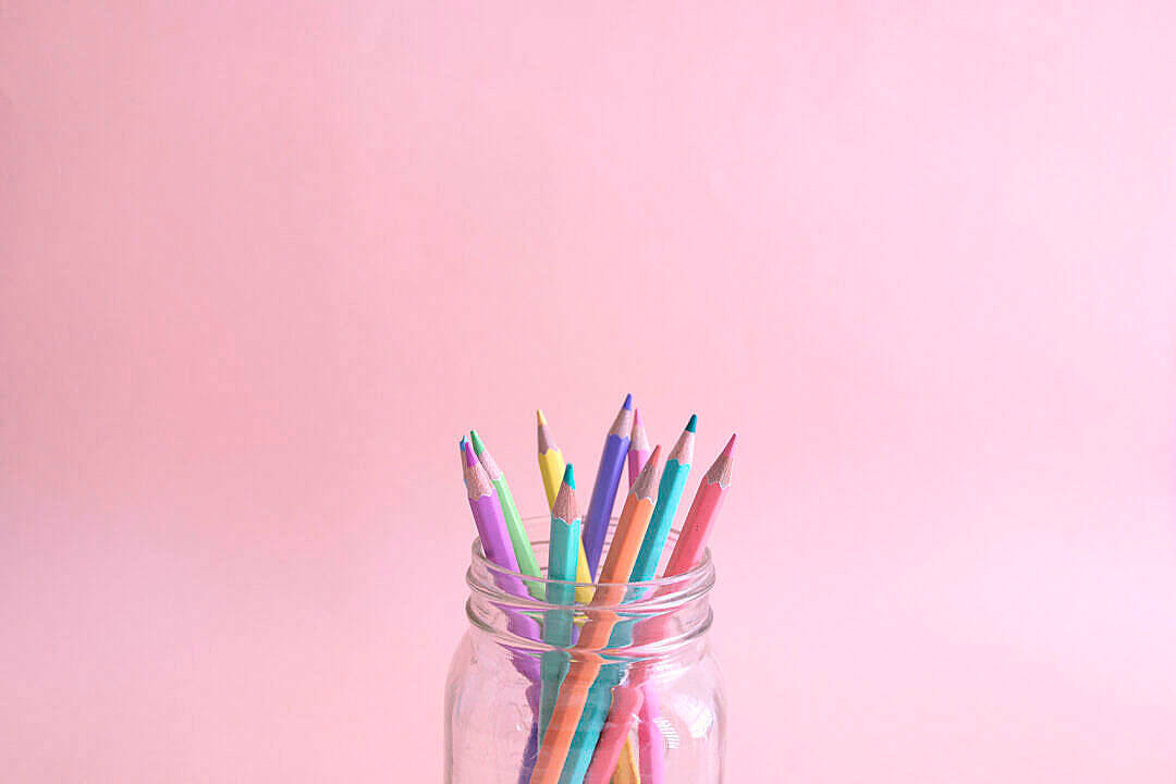 Color Pencils In Jar With Pastel Pink Color Background Wallpaper