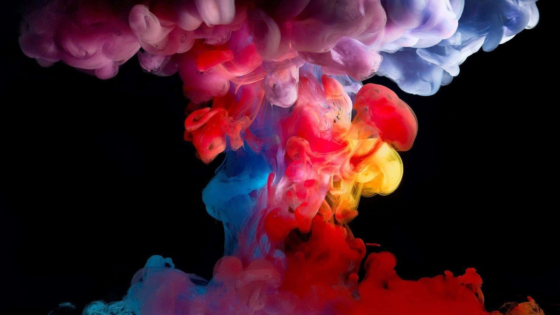 A Colorful Explosion Of Ink On A Black Background