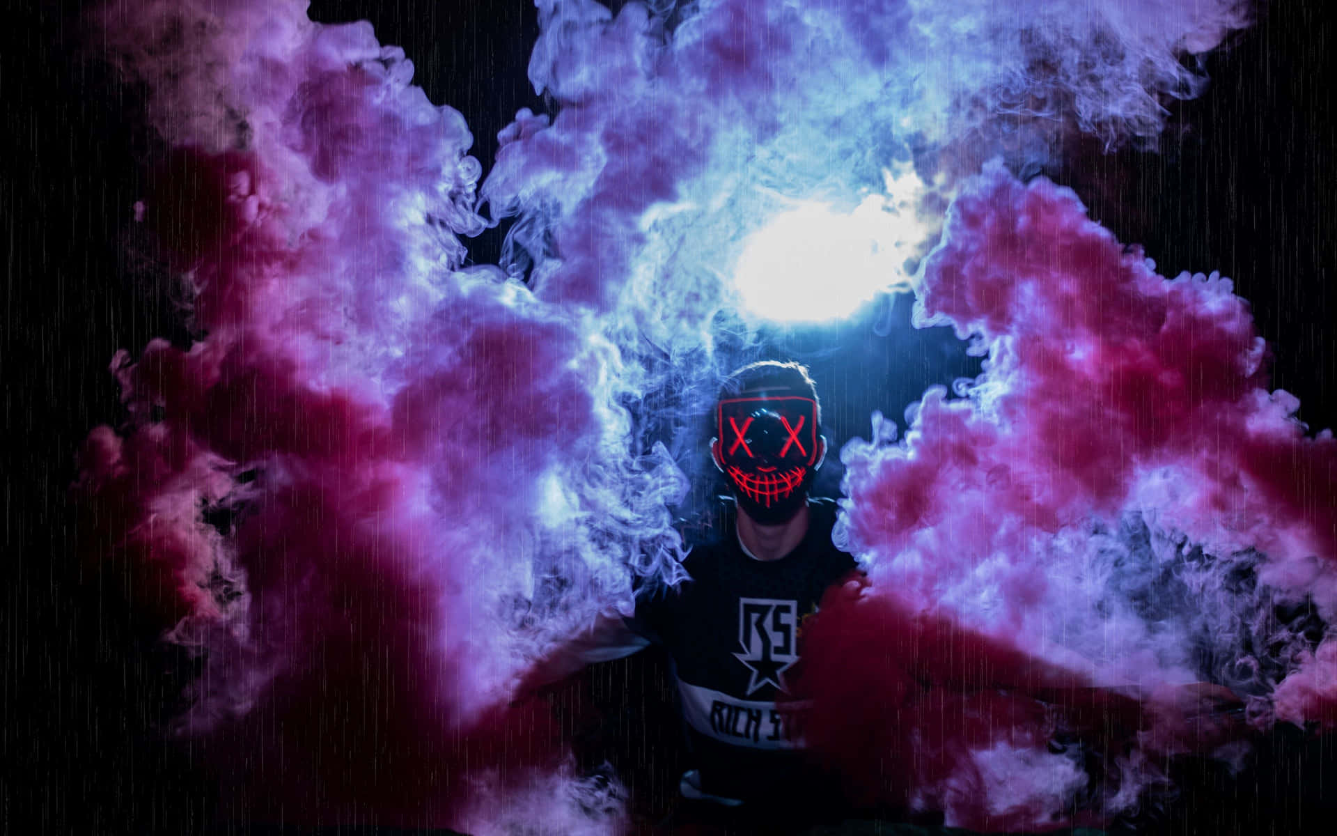 A Man In A Mask With Smoke Coming Out Of His Face