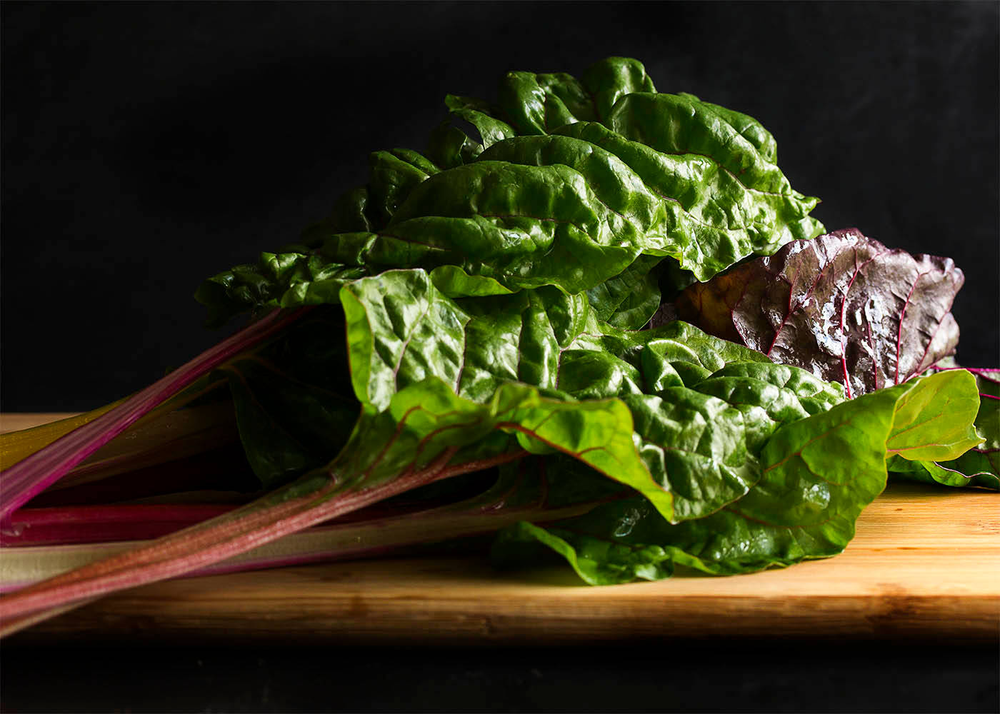 Colored Swiss Chard Vegetable On Wooden Board Wallpaper