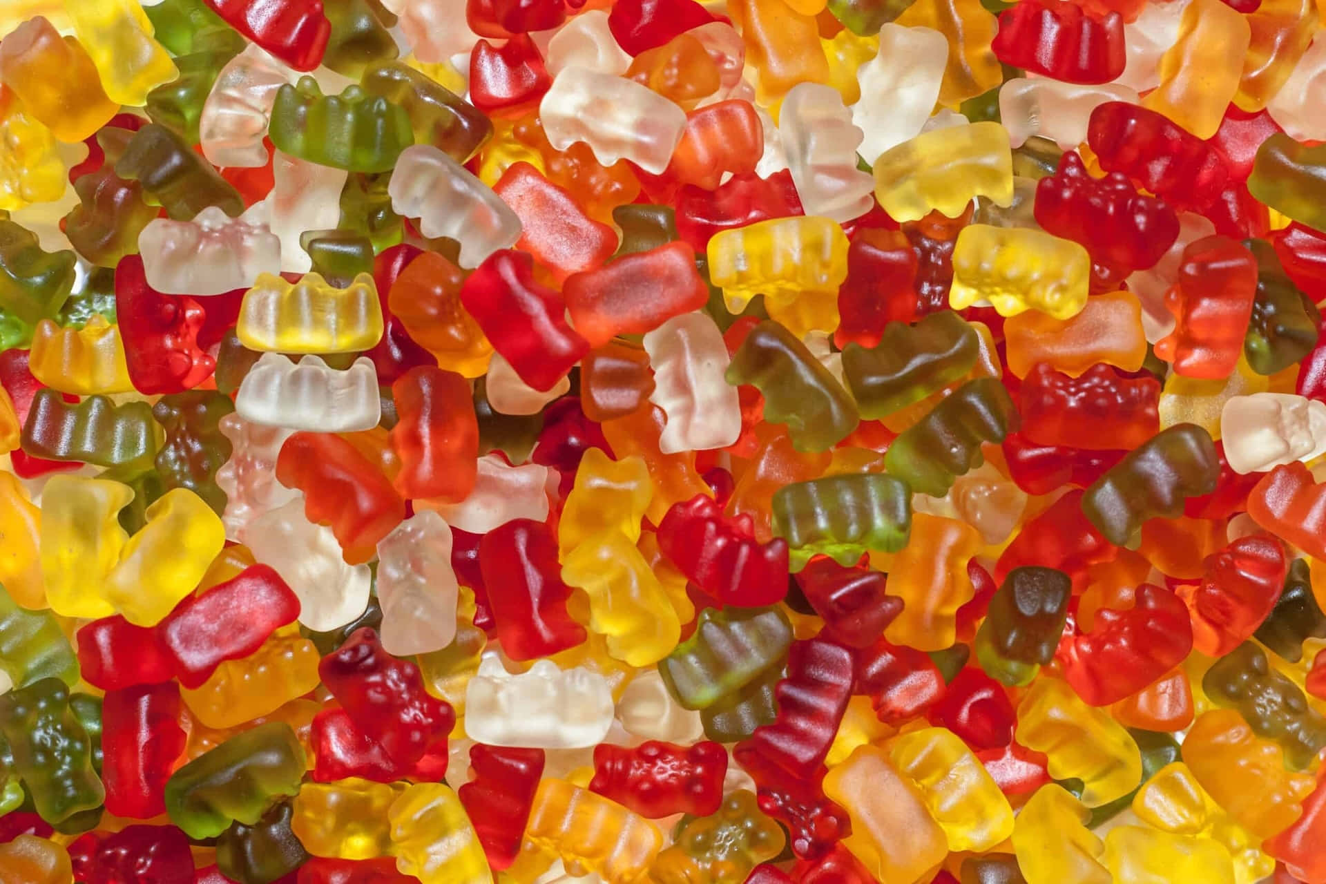 Colorful Assorted Gummy Bears Background Wallpaper