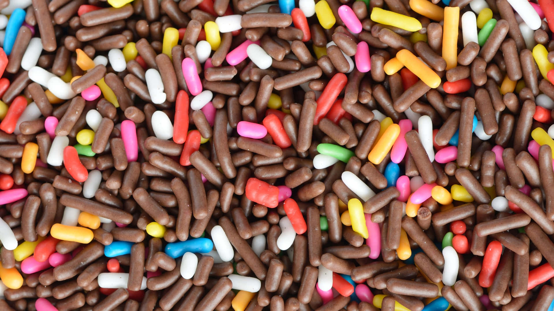 Colorful Assorted Sprinkles Background Wallpaper